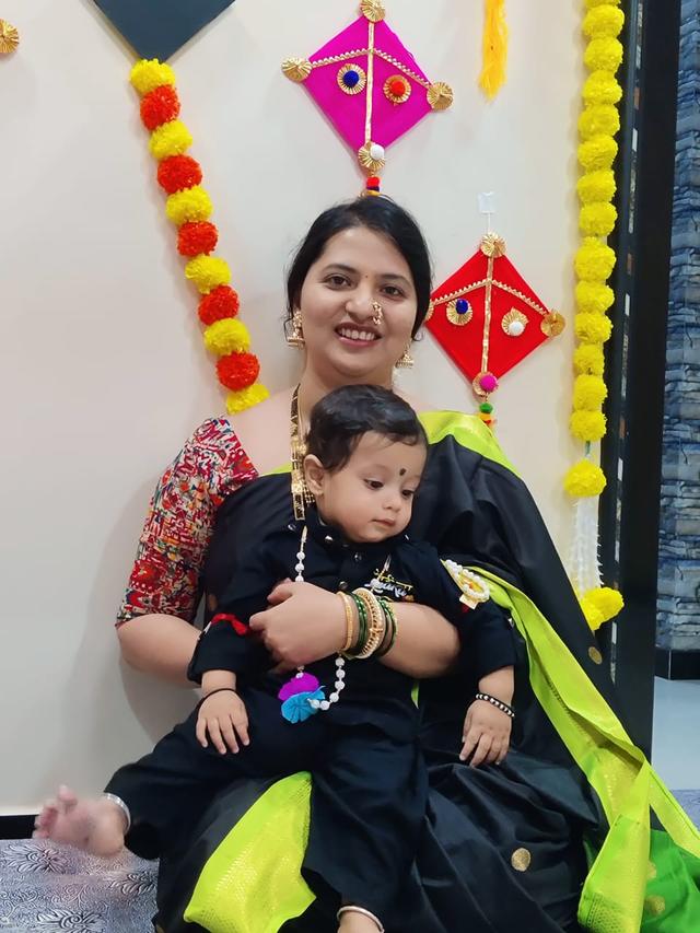 Flow 108 client with her baby at a celebration
