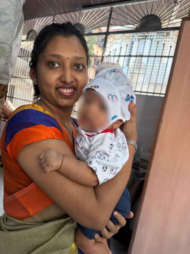 Flow 108 client holding her baby