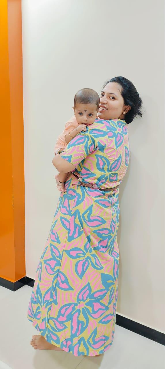 Flow 108 client carrying her baby